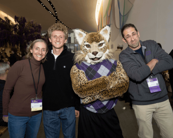 Three alumni hanging out with Bobcat