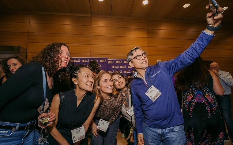 Alumni taking a group selfie at Reunion 2025
