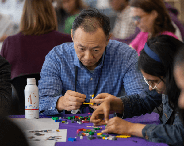 Alumni and Families Weekend 2025 participants building with Legos